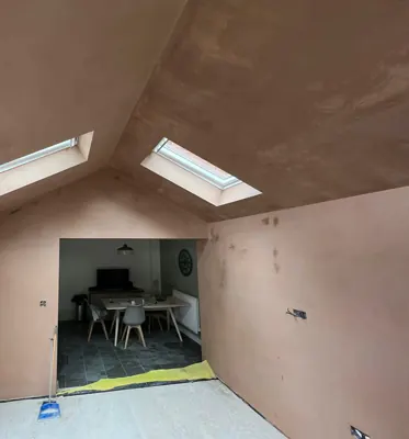 After: The same loft room skimmed in fresh pink plaster