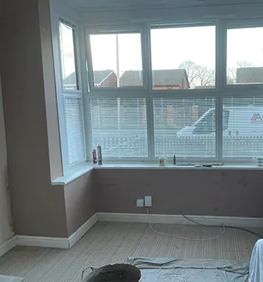 After: The same bay replastered and painted